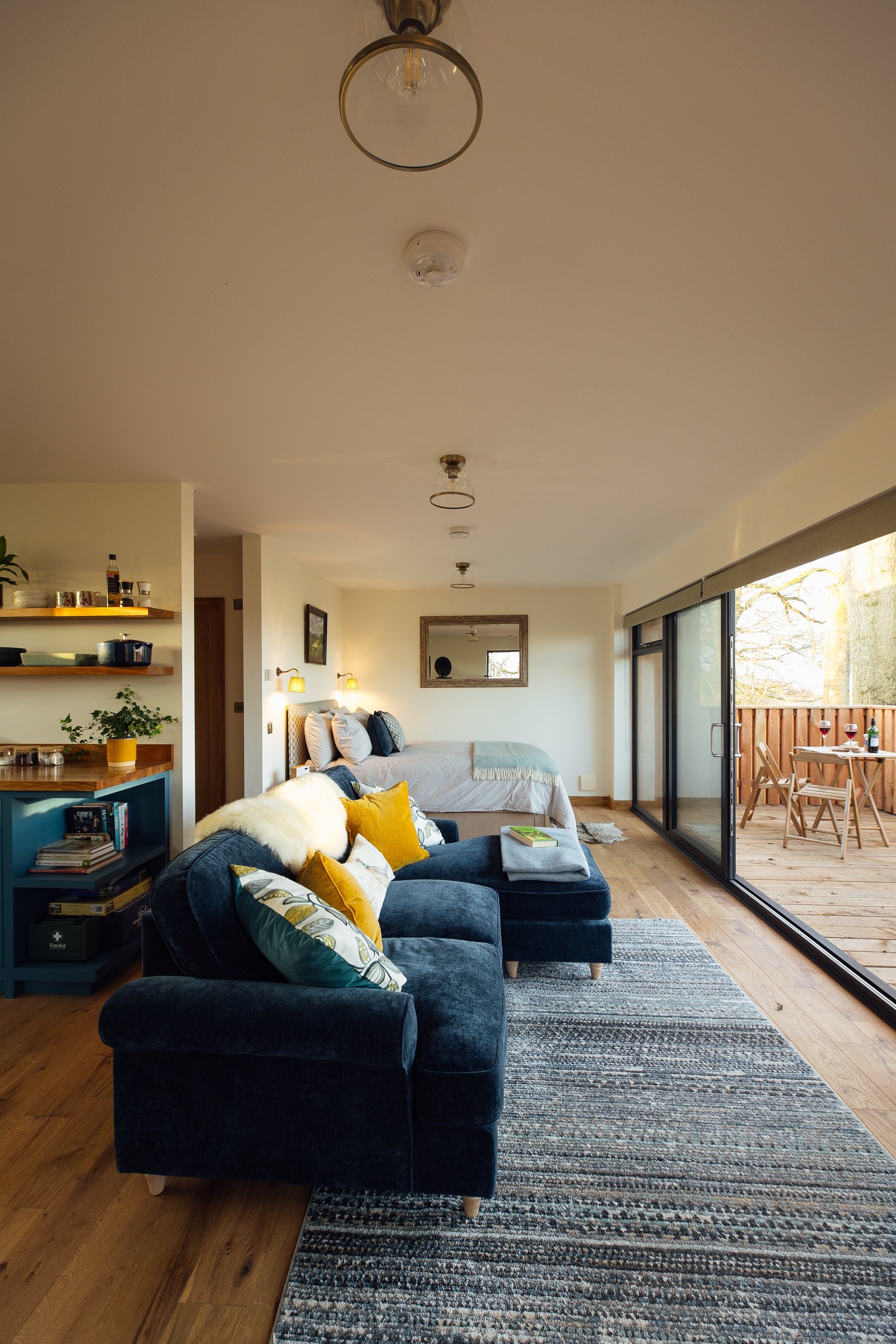 Warm cabin interior with the bedroom and sitting area